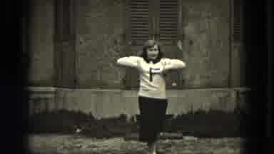 Milwaukee Wisconsin (1953): Slow Motion Of Girl Cheerleader Near Building With F