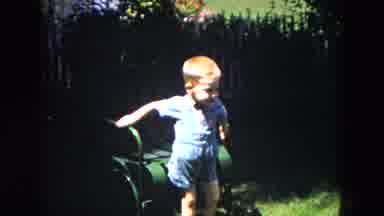 Milwaukee Wisconsin (1953): The Child Runs Away And Picks Up An Item In A Ground