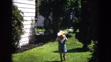 Milwaukee Wisconsin (1953): Little Boy Playing With A Bucket In His Family's Yard