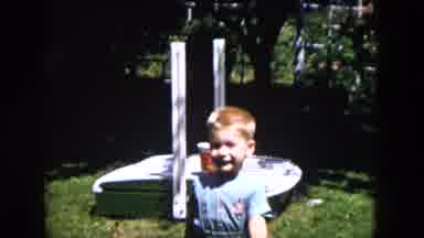 Milwaukee Wisconsin (1953): Toddler Boy Running In Backyard And Playing With A