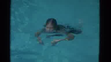 Yonkers New York (1953): Woman Swimming In A Pool While Doing Butterfly Strokes To