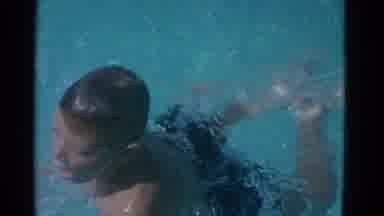 Yonkers New York (1953): Girl Dives Into Pool While Boy Swims Breaststroke On A