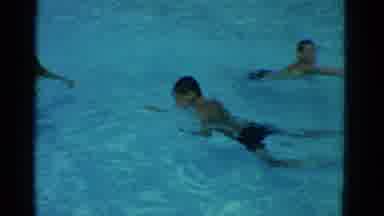 Yonkers New York (1953): Child Swims In Pool Towards Adult Male Before Going To
