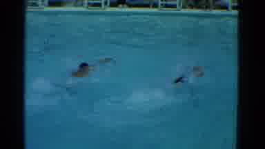 Yonkers New York (1953): Two People Freestyle Swimming Competitively In A Large