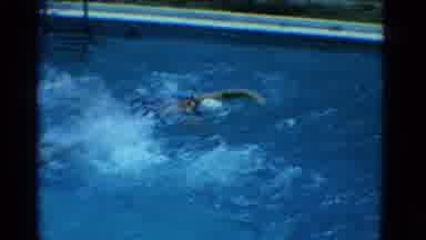 Yonkers New York (1953): Couple Wearing Black Swimwear Swim Laps In Pool On A