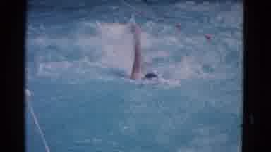 Yonkers New York (1953): Competitive Male Swimmer Performing The Backstroke In A