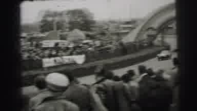 Le Mans France (1954): The Crowd Gasps As The Racer Rounds The Corner With Speed
