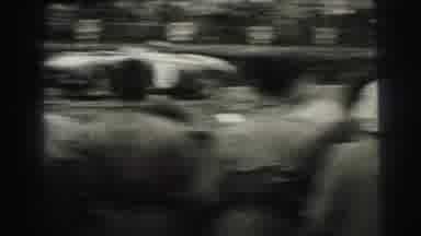 Le Mans France (1954): People Watching Cars Speed By In Race On A Cloudy Day