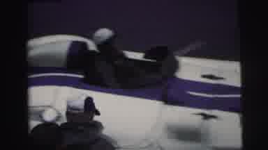 Le Mans France (1954): Man Wearing White Hat Gets Out Of Blue And White Vehicle On