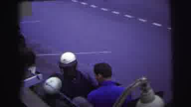 Le Mans France (1954): Person Wearing White Helmet Enters Into Blue And White