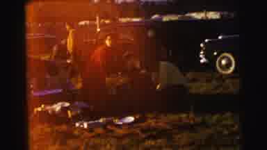 Le Mans France (1954): People Enjoy A Picnic Outdoors In A Classic Americana 1950s