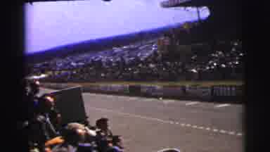 Le Mans France (1954): Crow Watches Cars Speed By At Car Race On A Bright Sunny