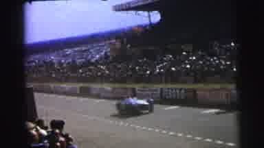 Le Mans France (1954): Crowd Spectators Watch Car Race Event On Raceway Track