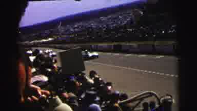 Le Mans France (1954): People Watchinging Race Cars In A Racetrack