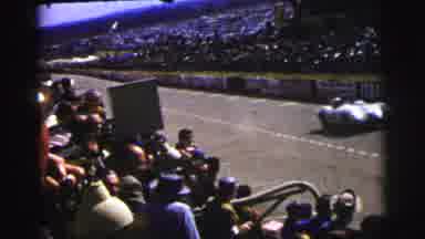 Le Mans France (1954): Spectators Pack The Stands As Race Cars Pace The Track