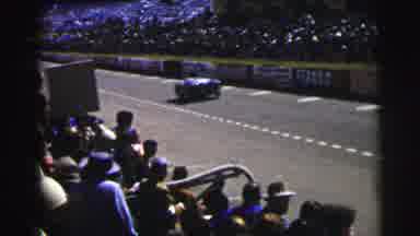 Le Mans France (1954): Packed Stands Of Spectators And Fans Watch As Race Cars