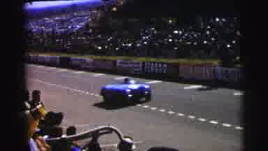 Le Mans France (1954): Vintage Blue Race Car Driving Down Track Watched By Crowds