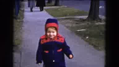 Hicksville New York-1954: Child Walking On Sidewalk In Red And Blue Coat