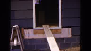 HICKSVILLE NEW YORK-1954: House Under Construction With Window Frame and Wooden Planks