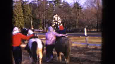 Hicksville New York (1954): Mother Walks Beside Small Child During Pony Ride On An