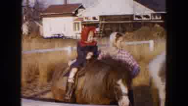 Hicksville New York (1954): Baby With Bonnet Riding Horse In Corral Next To Mother