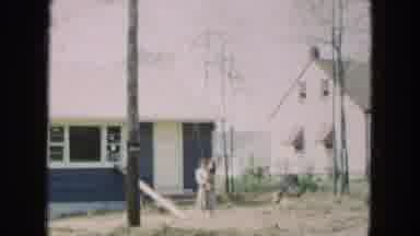 Hicksville New York (1954): Mother Holds Baby In Front Of The House As Camera Pans