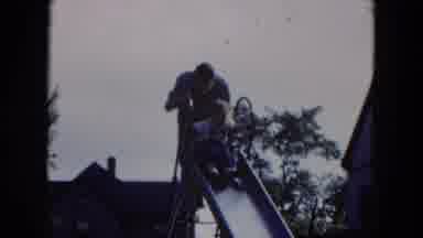 Hicksville New York (1954): Man In A Neighborhood Park Helps Small Child Up A