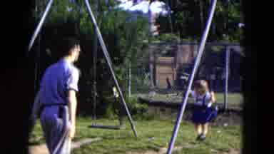 Hicksville New York (1954): A Man Is Swinging The Child And The Mother Also Swings