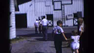 Hicksville New York (1954): Women Men And Children Walk For Fraternization In A