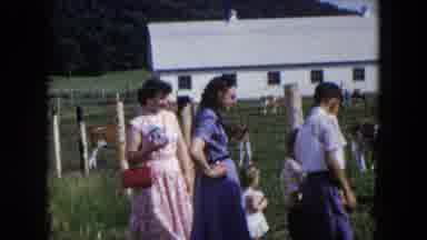Hicksville New York (1954): Two Women Stand With Children In Front Of A Wire Fence