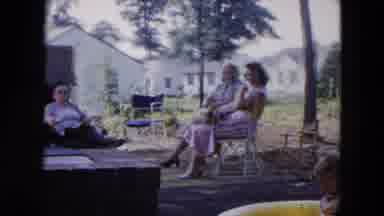 Hicksville New York (1954): Three Women Sitting On A Covered Porch In Chairs