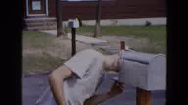 Hicksville New York (1954): Man Checks Mailbox In Front Of His Residence On