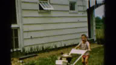 California USA (1954): Vintage Home Video Of A Boy Mowing His Lawn With Another