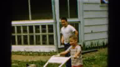 California USA (1954): Boys Mowing Yard