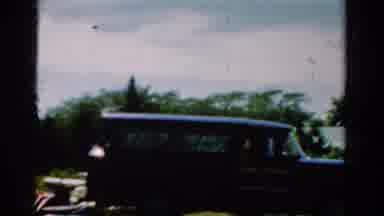 California USA (1954): Antique Car Parked Under The Clear Blue Sky Flagged By