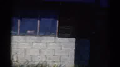 California USA (1954): Camera Pans Across Front Of Wood And Concrete Block