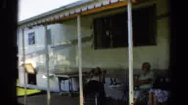 California USA (1954): Elder Family Members Hanging Outside During The Summer