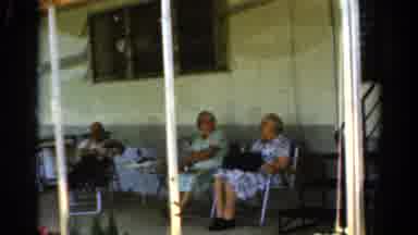 California USA (1954): Two Old Women Talk On A Back Porch Of A Nursing Home