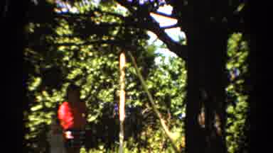 CALIFORNIA USA-1954: Child Plays Outside As Laundry Hanging On The Line Floats