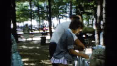 California USA (1954): A Few People Outside By Picnic Tables In The Sunshine