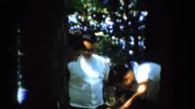 California USA (1954): Three Man In Shirts And Trousers Cooking In The Middle Of A