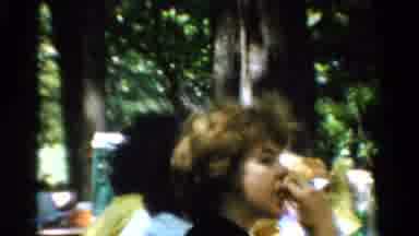 California USA (1954): Large Group Of People Enjoying A Picnic Outside Surrounded