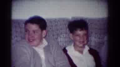 Toledo Ohio USA (1954): Three Boys Sit On Grey Sofa Laughing And Talking