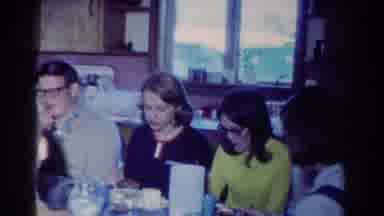 Toledo Ohio USA (1954): A Large Family Sitting Around A Kitchen Table Enjoying A