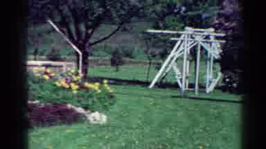 Toledo Ohio USA (1954): The Backyard Of A House With A White Swing Set And A