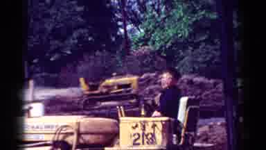Toledo Ohio USA (1954): Young Boy Sitting On Bulldozer Near House Talking To