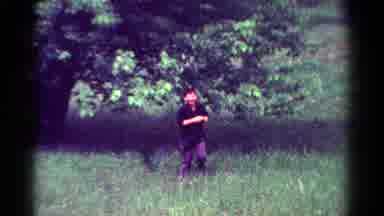Toledo Ohio USA (1954): A Kid Is Playing On A Field Near A Tree Looking To A