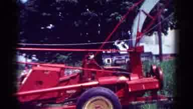 Toledo Ohio USA (1954): Red Wood Chipper Hooked Up To A Green Dump Truck