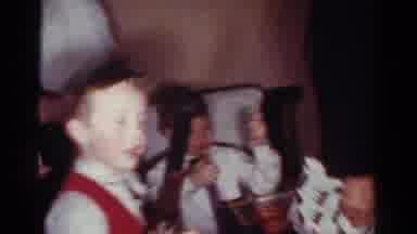Toledo Ohio USA (1954): Children Play With Toy Guns At Family Get Together Inside