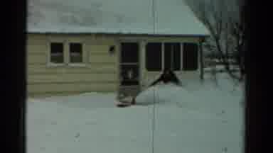 Toledo Ohio USA (1954): A Man Snow-Blowing The Snow Around His House And Yard
